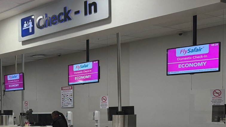 FlySafair check-in counter at OR Tambo International Airport.